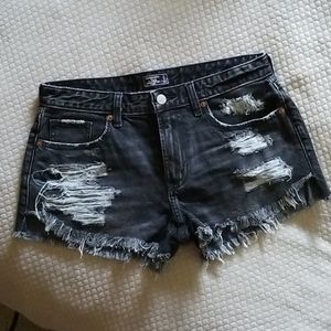 Distressed blue jean shorts